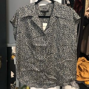 Short sleeved button down dotted blouse